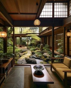 a living room filled with lots of furniture next to a stone floor covered in plants