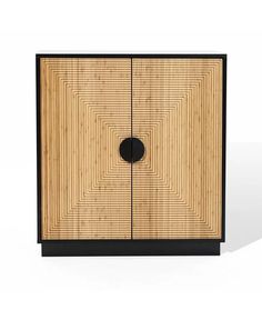 an image of a cabinet that is made out of wood and has a black circle on the door