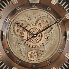 a close up of a clock face with gears on it's face and hands