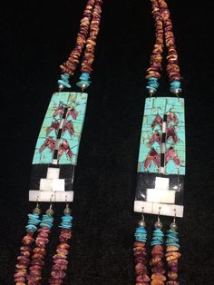 Native American Indian, Santo Domingo Pueblo artist Raymond Rosetta's unusual handmade vintage multi-stone Corn inlay, multi-strand necklace, with turquoise, purple & orange spiny oyster, mother of pearl, jet, pin shell (backing) & sterling silver beads, including handmade stamped cones at the end before adjustable finish...   Beautiful!  2 strands above Corn inlay pendants, 3 strands beneath... Corn inlay pendants are 3 3/8" x 1 1/8" x 3/16" deep.29-31" long necklace (short strand)***- Vintage Multicolor Multi-stone Jewelry, Unique Turquoise Jewelry With Inlay, Traditional Multicolor Rectangular Necklace, Southwestern Style Multicolor Necklaces With Natural Stones, Vintage Multi-stone Multicolor Jewelry, Bohemian Multicolor Rectangular Jewelry, One Of A Kind Multicolor Southwestern Necklace, Unique Rectangular Necklaces With Natural Stones, Unique Rectangular Natural Stone Necklace