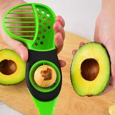 someone is peeling an avocado on a cutting board with a green grater