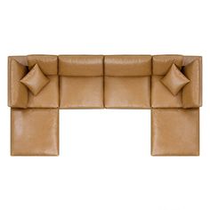 a brown leather couch with pillows on it's back and side ends, viewed from the front