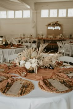 the table is set with plates and place settings