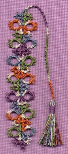 the necklace is made with beads and tassels, which are colored in different colors