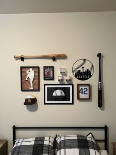 a baseball themed bedroom with pictures on the wall