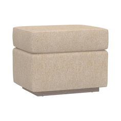 a beige ottoman sitting on top of a white floor