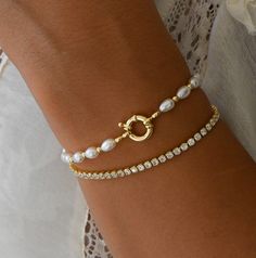 Simple and elegant pearl bracelet! Pairs nicely with other bracelets, but is also beautiful on it's own. Includes .5" extender. Materials: 14K Gold Plated / Pearls Elegant Silver Pearl Bracelet, Elegant Adjustable Chain Bracelet With Pearl Charm, Elegant Adjustable Pearl Charm Chain Bracelet, Gold Pearl Jubilee Bracelet, Pearl Wedding Bracelet With 17 Jewels, Adjustable Pearl Chain Bracelet For Formal Occasions, Adjustable Formal Pearl Bracelet, Formal Adjustable Pearl Bracelet, Elegant Pearl Chain Bracelet For Anniversary