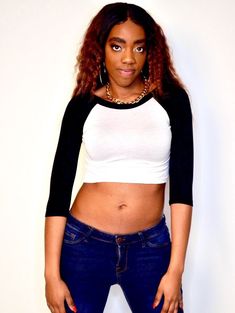 "This 3/4 sleeve white and black crop top fits soft and smooth against your body.  It is made from the popular and sporty raglan cut, and has a white body with black sleeves and collar. Best paired with: Jeans, cutoff shorts, yoga pants, or your favorite mini-skirt. The model is 5'6\" and wearing a size small. The fabric is stretchy and adjusts to the shape of your body.  Although we make every effort to portray the accurate colors, colors and fit may vary slightly from the picture due to lighting and body type, as with all apparel. Size Chart (inches):                              S            M           L Bust                      27-30 31-34    34-37 Natural Waist        26            28    30 Length                        12.5             13     15  Materials:  95% rayon, 5% spandex. Casual Fitted T-shirt With 3/4 Sleeves, Black Fitted Half-sleeve T-shirt, Black Fitted Half Sleeve T-shirt, Fitted Casual T-shirt With 3/4 Sleeves, Trendy White Stretch Cropped Shirt, Trendy Black Fitted Cropped Shirt, White Stretch Top With 3/4 Sleeve, Black Stretch Cotton Cropped Shirt, Fitted Black Cropped Shirt