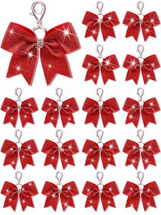 twelve red bows with swaroes hanging from the ends, all in different sizes and shapes