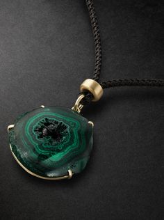 Jacquie Aiche carefully selects gemstones for their unique properties, the designer calls each piece of jewellery a "talisman of energy". This cord necklace is strung with a slice of malachite, a protective stone that's thought to clear negativity, in a gold prong setting. Luxury Malachite Necklaces For Gifts, Luxury Adjustable Necklace With Natural Stones, Luxury Green Onyx Gemstone Jewelry, Luxury Pendant Jewelry With Natural Stones, Spiritual Malachite Jewelry With Natural Stones, Luxury Large Stone Pendant Jewelry, Healing Gemstone Medallion Jewelry, Healing Malachite Gemstone Necklace, Spiritual Malachite Pendant Necklace