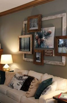 a living room filled with furniture and pictures on the wall