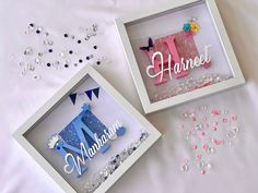 two personalized birthday gifts are sitting on a white sheet with confetti and streamers