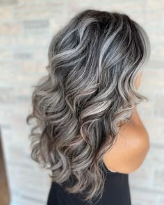 Gray Blending Is The Glamorous Way To Celebrate Your Silver Hair Gray And Silver Highlights On Black Hair, How To Start Blending Gray Hair, Two Tone Silver Hair, Brunette Gray Hair, Long Layered Hair Over 50, Grey Extensions, Growing Out Gray Hair Blending, Grey Hair Model, Mum Hair