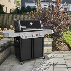 an outdoor bbq grill with two burners on it