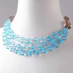 Handmade Light Blue Multi-strand Jewelry, Light Blue Multi-strand Jewelry As Gift, Light Blue Multi-strand Jewelry For Gift, Light Blue Multi-strand Jewelry Gift, Formal Blue Glass Jewelry, Luxury Blue Beaded Necklace With Polished Beads, Luxury Blue Polished Beads Necklace, Blue Multi-strand Gemstone Beaded Necklace, Luxury Blue Necklace With Polished Beads