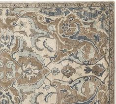 an area rug with various colors and patterns on it, including blue, brown, beige and white