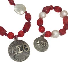 Delta Sigma Theta Red Acrylic Necklace Bracelet Set METAL: Stainless Steel, Plated Charm APPROX SIZE: 18" Adjustable Length CLOSURE: Lobster Claw Clasp BRACELET APPROX. SIZE: Fits 7"-7.5" WristBRACELET CLOSURE: No Clasp, Stretch Elastic Symbolic Red Bracelet Jewelry, Red Symbolic Bracelet Jewelry, Symbolic Red Round Beads Jewelry, Symbolic Red Jewelry As Gift, Adjustable Red Jewelry With Lobster Clasp, Personalized Vintage Red Jewelry, Adjustable Red Personalized Necklace, Acrylic Necklace, Alpha Delta