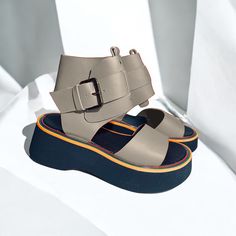 This highly favored model offers a stylish and comfortable option for everyday wear. The sandals feature a moderately soft and stable platform with a height of 3 cm at the front and 5 cm at the back. The design ensures a snug fit with an adjustable buckle around the ankle for added security. Available in a wide range of colors, these sandals not only provide exceptional comfort but also add a fashionable touch to your outfit. Materials: Genuine leather Sole: Stylish and flat Sole height: front 3 cm / back 5 cm Suitable for: Everyday use Additional features: Adjustable buckle for ankle Discover the perfect blend of style and comfort with our handmade black leather and patent leather platform sandals. These unique lace-up sandals are designed for the modern woman who values both elegance and Gray Leather Shoes, Highly Favored, Elegant Gift Wrapping, Women Platform Sandals, Handmade Sandals, Leather Platform Sandals, Gray Leather, Lace Up Sandals, Comfortable Sandals