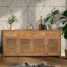 a wooden cabinet sitting next to a plant on top of a hard wood floor covered in potted plants