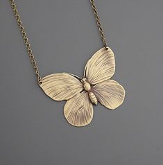 "Vintage Necklace - Butterfly Necklace - Brass Necklace - Butterfly Jewelry - Statement Necklace - handmade jewelry This is such a fabulous vintage brass necklace!  A lovely large butterfly.  Great detail with a beautiful patina.  The pendant hangs from a delicate vintage brass ladder chain. Chloe says, \"Wear it and feel fabulous!\" This pendant is 2\" wide.  Thanks for visiting Chloe's" Gold Nickel-free Butterfly Necklace, Nickel Free Gold Butterfly Necklace, Vintage Handmade Butterfly Necklace, Butterfly Charm Brass Jewelry Gift, Brass Jewelry With Butterfly Charm For Gift, Vintage Bronze Jewelry For Crafting, Handmade Butterfly-shaped Metal Jewelry, Handmade Butterfly Shaped Metal Jewelry, Handmade Gold Bohemian Butterfly Necklace