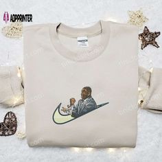 Introducing the iconic collaboration of Mike Tyson and Nike, the Swoosh Embroidered Shirt. Made with premium quality fabric, this shirt Nike Inspired, Embroidered Apparel, Embroidered Portrait, Limited Edition Shirt, Stylish Celebrities, All Over Print Shirt, Mike Tyson, Embroidered Clothes, Sports Apparel