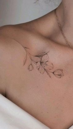 a woman's chest with flowers on it