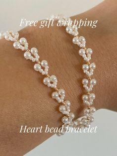 a woman's arm wearing a bracelet with pearls on it and the words free gift wrapping