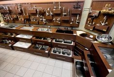 a kitchen filled with lots of wooden cabinets