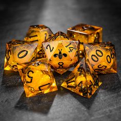 yellow and black dice with numbers on them