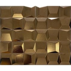 an image of gold metallic tiles that look like hexagonals or cubes