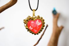 A red heart is mainly used as a symbol of love. Heart pendant, colored resin. Gold metal pendant, colored UV resin. The decoration was done by myself. Sent in gift packaging in a tracked package. https://crealliot.etsy.com Red Hand Painted Pendant Necklaces, Hand-painted Red Jewelry For Valentine's Day, Hand Painted Red Jewelry For Valentine's Day, Red Heart-shaped Hand Painted Jewelry, Red Keepsake Pendant Necklace, Red Jewelry For Valentine's Day Keepsake, Red Enamel Heart Pendant Necklace, Enamel Heart Pendant Necklace For Gift, Enamel Heart Charm Necklace For Gifts