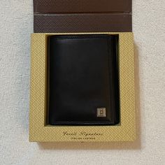 New In Box Trifold Soft Leather Wallet. Box Shows Normal Signs Of Wear And Tear From Being Packed And H Packed During Various Moves, But The Wallet Itself Is In Pristine Condition. Comes From A Smoke Free Home With Pets. Black Rectangular Trifold Wallet For Formal Occasions, Elegant Black Trifold Wallet, Elegant Black Rectangular Trifold Wallet, Elegant Black Trifold Wallet For Formal Occasions, Elegant Wallets With Box Included For Gift, Elegant Wallets With Box For Gift, Elegant Black Trifold Wallet For Business, Elegant Black Wallet With Rectangular Case, Elegant Black Rectangular Wallet