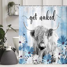 a shower curtain with an image of a cow and daisies on it that says get naked