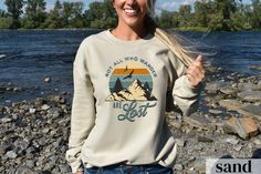 ▪ Not All Who Wander Are Lost Sweatshirt will be your favorite! Buy for your next camping trip! ▪ Enjoy the super comfy feel of our warm sweatshirts! ▪ Gildan brand ▪ All of our sweatshirts are UNISEX adult sizing, please refer to our sizing chart in the photo to make sure you get the correct fit. ▪ Our sweatshirts are printed and shipped from the US ▪ The design is printed right into the fabric, this will make it more durable but may appear slightly less vibrant when you receive it. ▪ Cotton/Polyester blend - won't shrink or stretch out of shape ▪ Loose fit ▪ Ribbed knit collar that retains shape ▪ No side seams, makes it very comfy and looks great Washing Instructions: ✔ Non-chlorine bleach as needed ✔ Tumble dry: medium heat ✔ Iron: do not iron ✔ Do not dry clean ✔ Machine wash warm (ma Relaxed Fit Graphic Sweatshirt For Camping, Winter Casual T-shirt For Outdoor Activities, Casual Winter T-shirt For Outdoor Activities, Casual Graphic Print Sweatshirt For Hiking, Casual Long Sleeve T-shirt For Camping, Fall Hiking Sweatshirt With Letter Print, Crew Neck Sweatshirt For Camping, Casual Hiking Sweatshirt With Letter Print, Casual Crew Neck Sweatshirt For Adventure