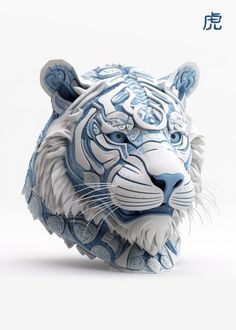 a blue and white porcelain tiger head on a white surface with chinese characters in the background