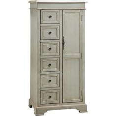 an old white cabinet with drawers on it