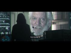 an old man with white hair and beard in front of a computer screen that says, that destroy us