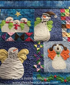 a quilted wall hanging with snowmen and angels on it's sides, all in different colors