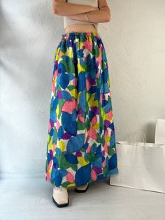 "- Vintage 1970s handmade rainbow skirt - Feathery material - Elastic at the waist - XS Waist: 22\" - 27\" Length: 41\"" Multicolor High Waist Maxi Skirt, High Waist Multicolor Lined Skirt, High Waist Multicolor Skirt For Spring, High Waist Multicolor Maxi Skirt, Retro Multicolor Mini Skirt, Hippie Multicolor Lined Skirt, Bohemian High Waist Multicolor Skirt, Bohemian High-waist Multicolor Skirt, Multicolor High Waist Lined Skirt