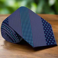 This silk necktie, featuring a sophisticated dark blue background adorned with light blue polka dots, is a perfect blend of classic and playful styles. The contrasting colors and charming pattern make it a versatile accessory for various occasions, adding a touch of elegance and fun to your attire. Dress Shirts: White Dress Shirt: A white dress shirt offers a clean and classic look, making the dark blue and light blue polka dots stand out beautifully, perfect for both formal and semi-formal sett Brown Bow Tie, Yellow Bow Tie, Light Blue Dress Shirt, Purple Bow Tie, Polka Dot Bow Tie, Tie Matching, White Bow Tie, Plaid Bow Tie, White Dress Shirt