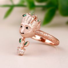 Each cartoon tree style ring is made of sterling silver, the design is very cute and super adorable. If you or someone you love is a baby tree at heart, each ring is a must-have piece in your jewelry collection! The tree baby is so cute, smart and all of us love his brave. If you want him to be always by your side, put on this ring immediately.Weight: 5.95 gWidth: 21.6 mmHeight: 25.8 mmThickness: 3 mmMaterial: 925 SilverPlating Color: Rose Gold Whimsical Sterling Silver Ring Gift, Whimsical Sterling Silver Ring As Gift, Whimsical Sterling Silver Ring For Gift, Whimsical Sterling Silver Rings For Gifts, Cartoon Tree, Baby Tree, Dangle Ring, Tree Man, Always By Your Side