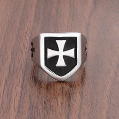 Presenting this Knights Templar Commandery Ring in durable stainless steel, showcasing a bold black and silver design. This emblematic ring symbolizes the strength and heritage of the esteemed order, a striking statement of commitment and honor. Metals Type: Stainless Steel Surface Width: 20mm Ring Face: 1.9cm*1.64cm Weight: 13g We ship worldwide to 185 countries! Please allow 1-2 business weeks for your order to arrive. Iron Cross Ring, Steel Armor, Silver Knight, Iron Cross, Steel Gifts, German Army, Cross Ring, Bold Black, Knights