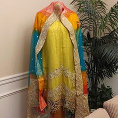 New Never Worn Size.M Beautiful Multi Color Heavy Embroidered Pakistani/Indian Shalwar/Trouser Shirt/Qameez Suit With Multi Color Dopatta/Scarf Orange/ Green/Pink Yellow Golden Size M New Never Worn Party Wedding Eid Formal Pakistani Indian Wear Sequins Machine Hand Embroidered With Pearls And Hanging Tussels Fancy Formal Party Wear Formal Wear Wedding Wear Mayon Mehndi Suit Lined Shirt Jamawar Embroidered Shirt Satan Soft Golden Embroidered Trouser Heavy Bordered Dopatta Net Dopatta Approx Meas Mehndi Suit, Shalwar Suit, Pakistani Dress Design, Pakistani Designers, Formal Party, Wedding Wear, Embroidered Shirt, Indian Wear, Formal Wear