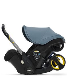 an infant car seat with a handlebar attached to the side and wheels on it