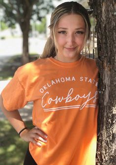 Oklahoma State Cowboys Womens Orange New Basic Short Sleeve T-Shirt - 16650743 Oklahoma State Shirts, Orange Short Sleeve T-shirt For Game Day, Casual T-shirt With Lettering For Game Day, Orange Cotton T-shirt For Game Day, Casual Text Print T-shirt For Fan Gear, Collegiate T-shirt With Lettering For College, Casual T-shirt With Lettering For Fans, Fan Merchandise Short Sleeve T-shirt With Lettering, Fan Merchandise T-shirt With Lettering And Short Sleeves