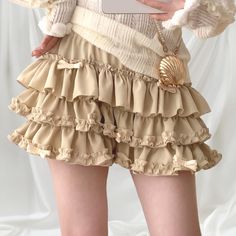 ➽Details:  * With shorts underneath * Multi-layered ruffle design for a voluminous, playful look * Adorned with cute bow accents * Elastic waistband for a comfortable fit ➽Laid flat measurement： Waist: 30-43cm(elastic) Length: 30cm One size, would recommend UK 6/8, XS/S, plz read the measures before purchasing. 🌸The top shown in the pics is available here⬇️⬇️ 🌸About the sizing: Most of the clothes in my store are labelled as Japanese 'one size', similar to the sizing used by many Japanese wome Fairycore Outfit, Robes D'occasion, Tiered Mini Skirt, Ruffle Design, Lace Dress Vintage, Vintage Floral Dress, Romantic Style, Japanese Women, Cute Bows