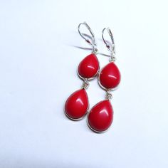 On offer are these Upcycled Vintage Ox Blood Red Coral Earrings featuring two teardrop shape Deep Red Coral Cabochons set in sterling silver bezels with sterling silver lever backs for pierced ears. In excellent vintage condition with no damage or repairs with two small natural coral inclusions on the back of the earrings and minor wear as conducive to their age. The coral is nicely polished so it gleams with a luster. The sterling silver lever backs are a recent replacement for the original one Red Teardrop Earrings As A Gift, Red Hypoallergenic Drop Jewelry, Hypoallergenic Red Drop Jewelry, Red Elegant Nickel-free Teardrop Earrings, Red Hypoallergenic Teardrop Earrings, Nickel Free Red Teardrop Earrings, Nickel Free Red Drop Earrings, Classic Red Teardrop Pendant Jewelry, Nickel-free Red Teardrop Earrings