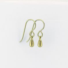 "Tiny gold color anodized titanium teardrop earrings are a pretty staple piece for your sensitive ears. They dangle from titanium French earwires hooks. The titanium is colored through anodizing, this makes the outer layer thicker with titanium and doesn't add other metals, so it is still pure titanium, but colored a beautiful yellow gold. These earrings are completely made out of pure titanium findings and therefor safe for when you have severe nickel allergies. Simple jet feminine for everyday Gold Hypoallergenic Teardrop Earrings For Everyday, Adjustable Gold Teardrop Earrings With Ear Wire, Adjustable Gold Teardrop Earrings, Minimalist Hypoallergenic Metal Teardrop Earrings, Gold Hypoallergenic Brass Teardrop Earrings, Brass Teardrop Drop Earrings For Pierced Ears, Gold Hypoallergenic Teardrop Earrings Gift, Hypoallergenic Gold Teardrop Brass Earrings, Hypoallergenic Gold Teardrop Earrings In Brass