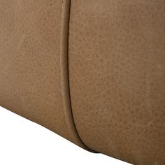 the back end of a tan leather couch