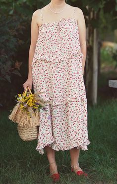 A lightweight floral dress with spaghetti straps, ruffled hem, and a flowing silhouette. Perfect for a cottagecore and bohemian summer style. No tags The model wears size 38 The size is adjustable, suitable from S - L the fabric feels like polyester Clothes care Machine washable Please note: We sell vintage items, not new ones. All our items are in excellent condition, washed, ironed and ready to wear. We also repair some items, sew on buttons and keep them in perfect condition. Please expect normal wear/age. Cottagecore Ruffle Hem Dress For Brunch, Sleeveless Midi Dress With Ruffles For Picnic, Garden Party Sundress With Ruffle Hem And Spaghetti Straps, Cottagecore Flowy Dress With Ruffles, Cottagecore Ruffled Dresses For Brunch, Flowy Cottagecore Dress With Ruffles, Ruffled Sundress Maxi For Picnic, Casual Maxi Dress With Floral Print And Ruffled Straps, Sundress Style Maxi Dress With Ruffles For Picnic